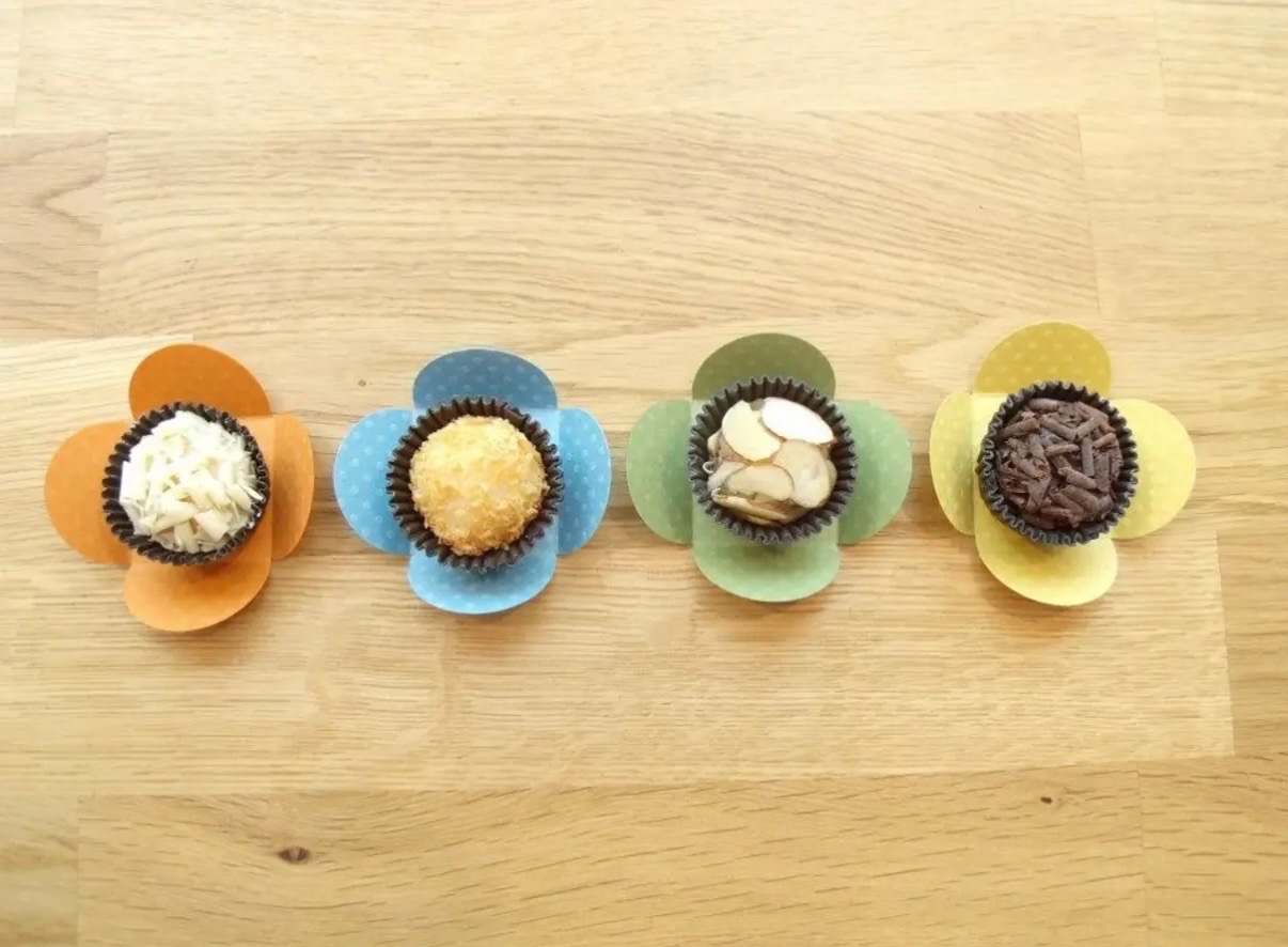 A Studio Brigadeiro gift box filled with chocolate brigadeiros.